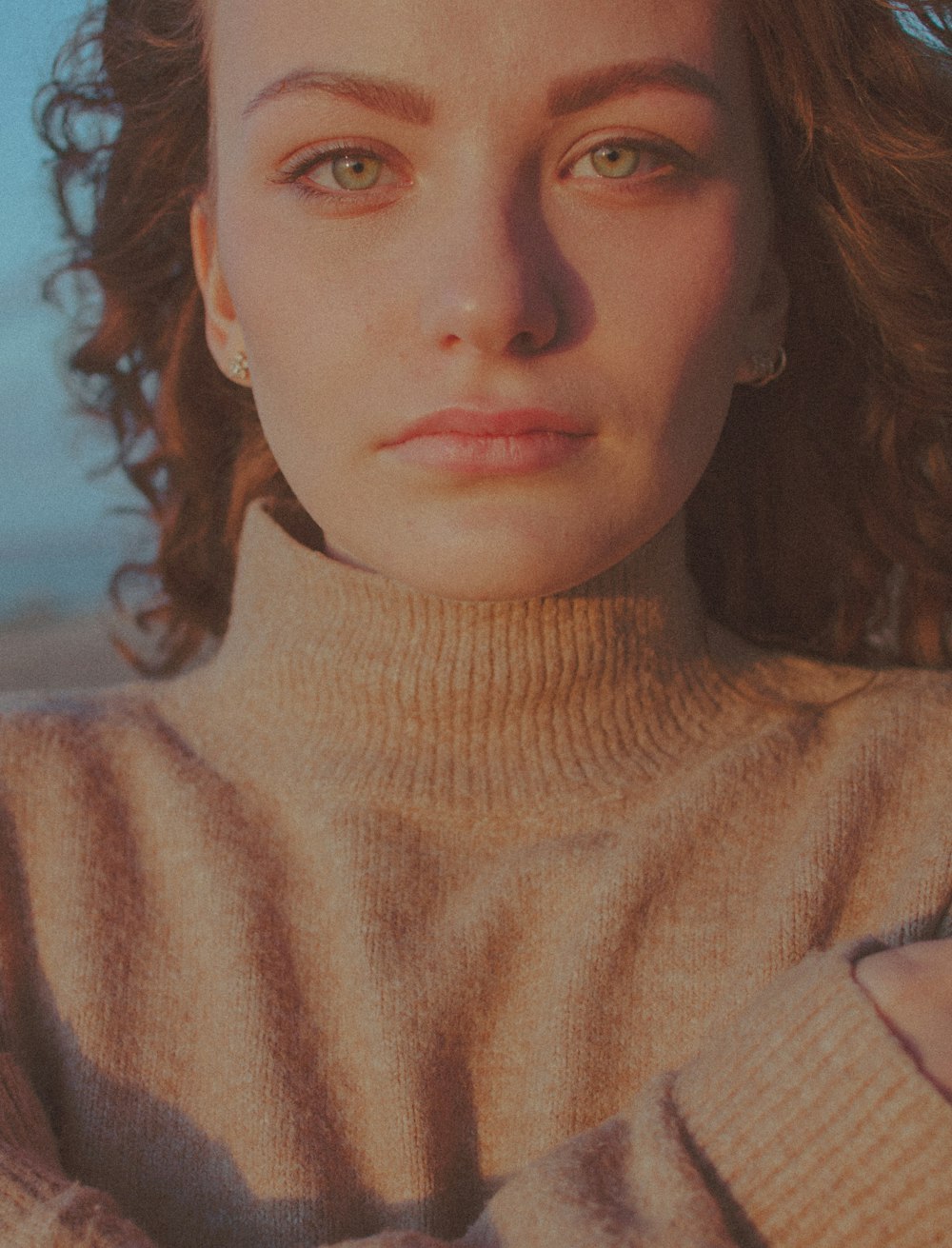 woman in beige turtleneck sweater