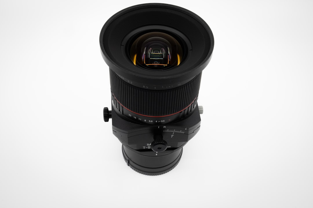 black camera lens on white background