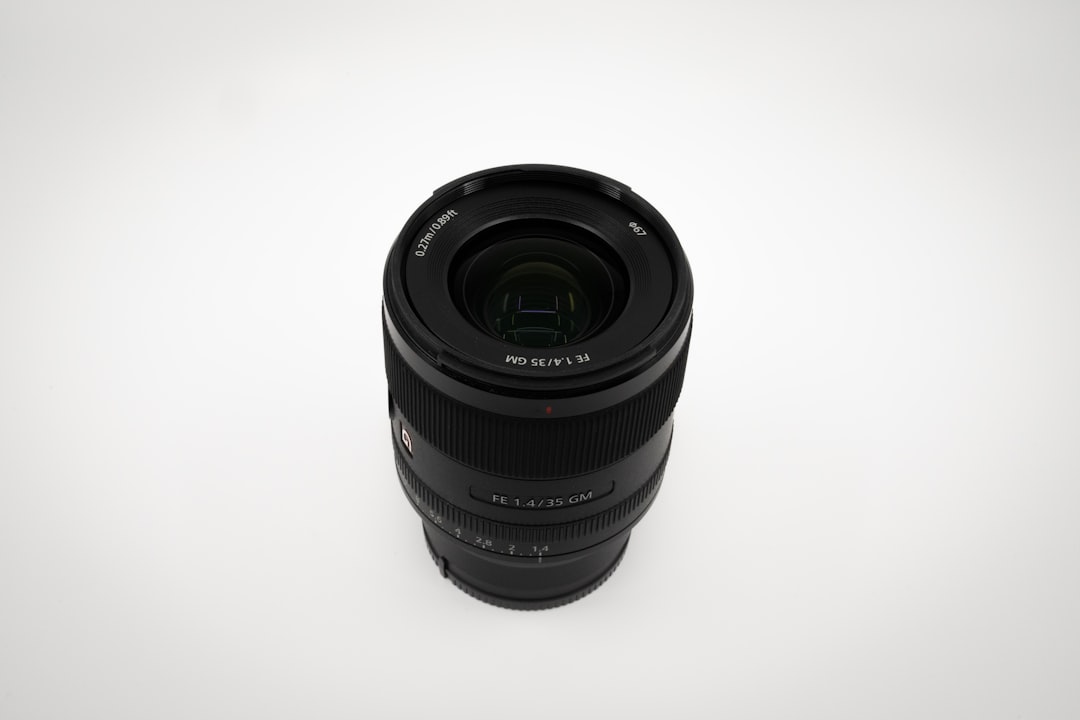 black camera lens on white surface