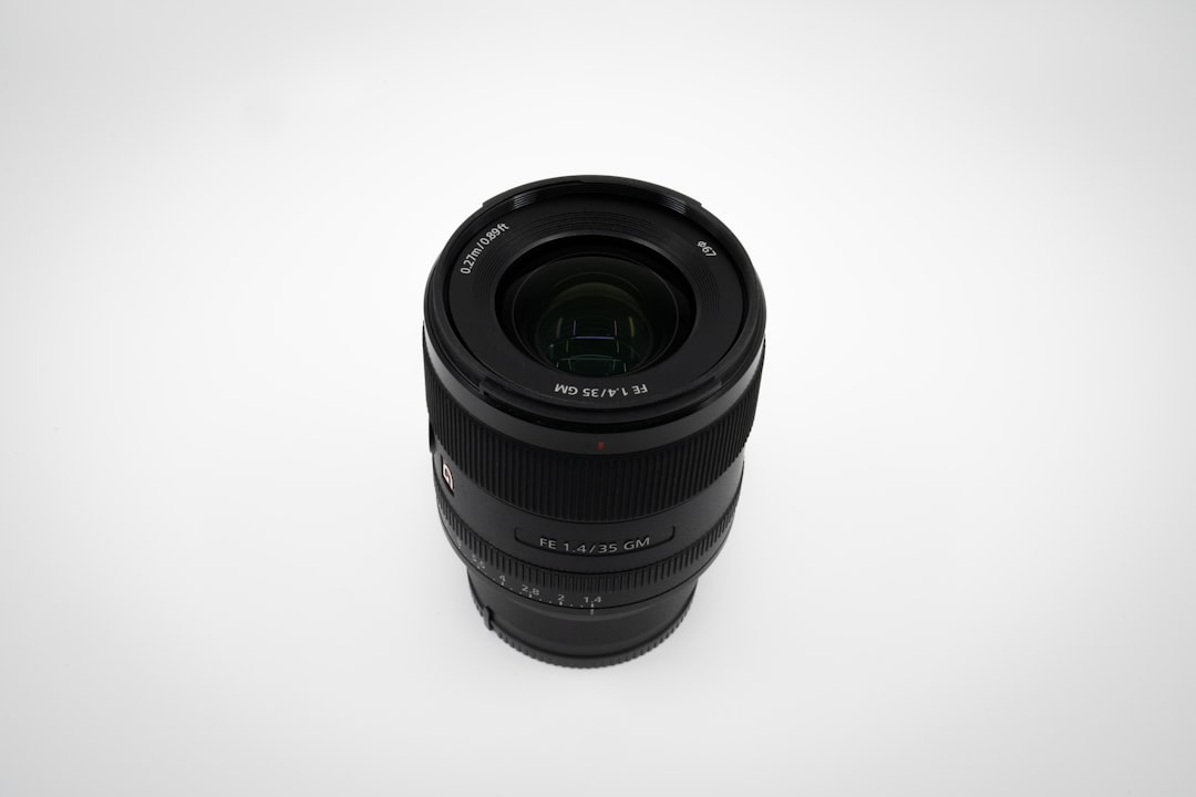 black camera lens on white surface