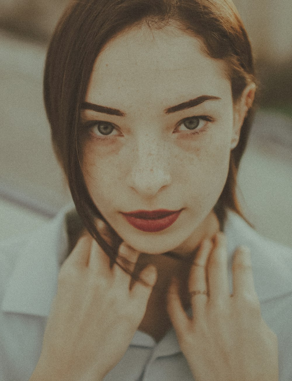 woman in white shirt with red lipstick