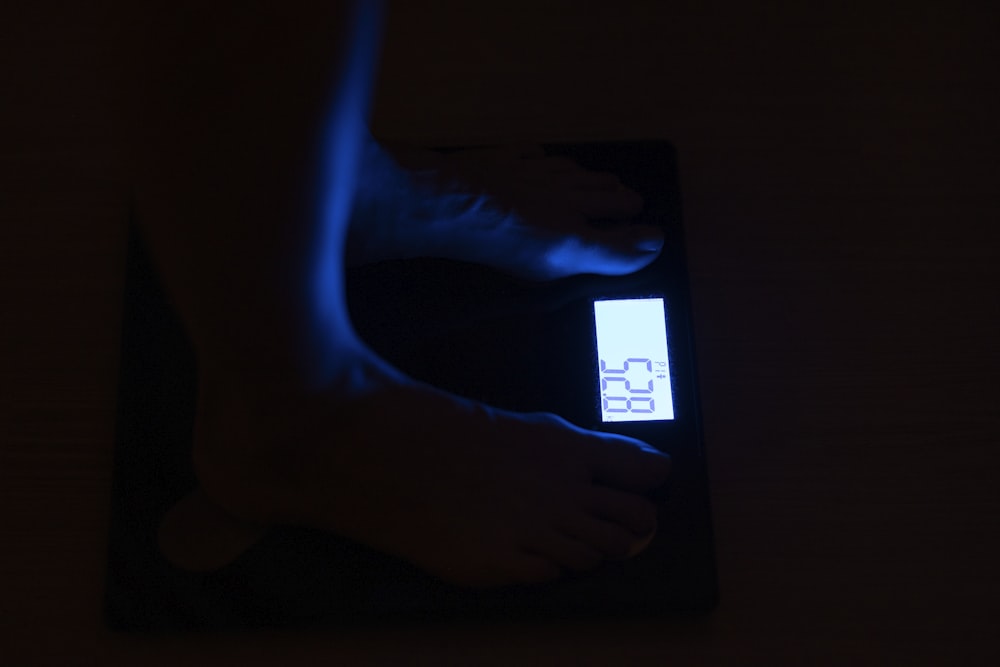 person standing on bathroom scale at 68 4