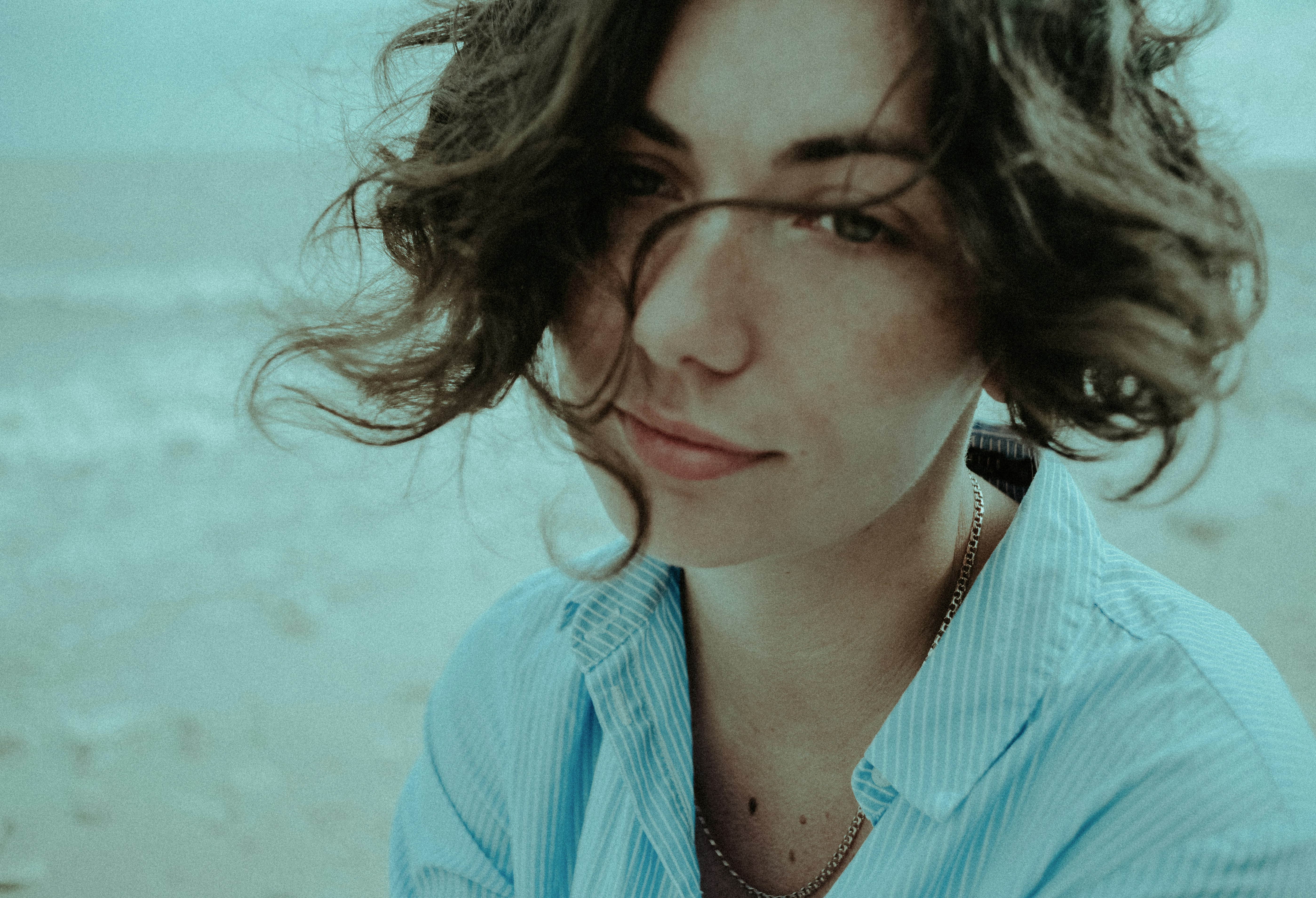 woman in blue and white polka dot button up shirt