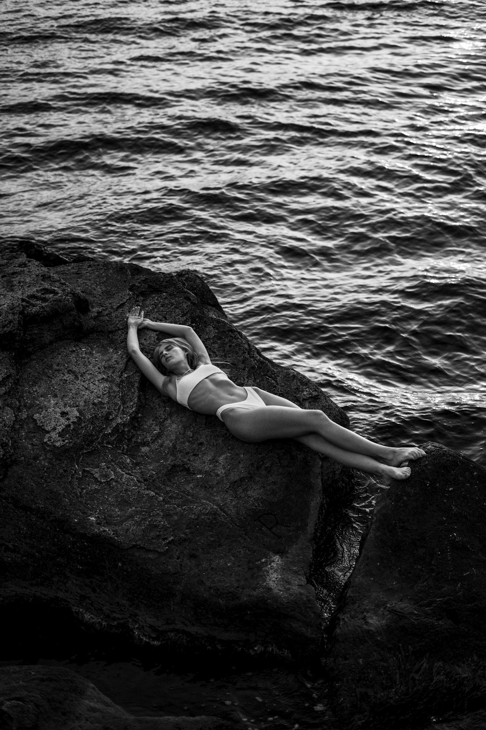 woman in bikini lying on the beach