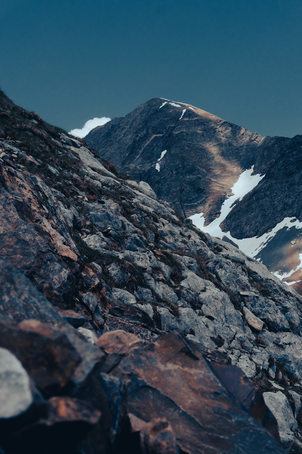 gray rocky mountain under blue sky during daytime