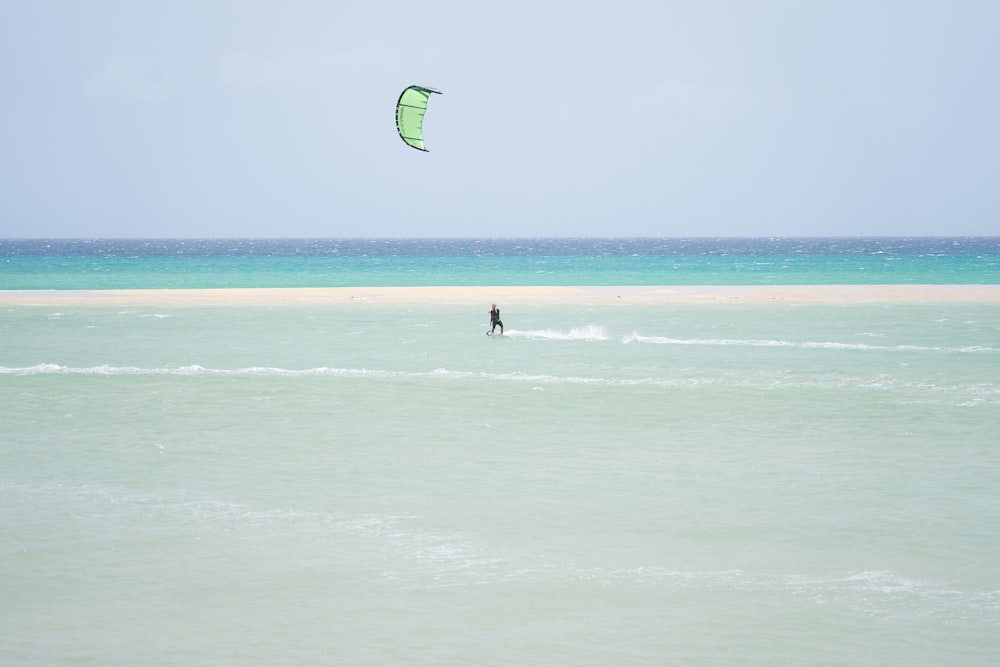 person surfing on sea waves during daytime