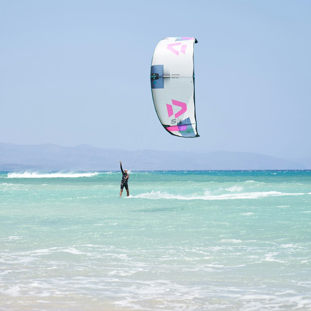 person surfing on sea during daytime