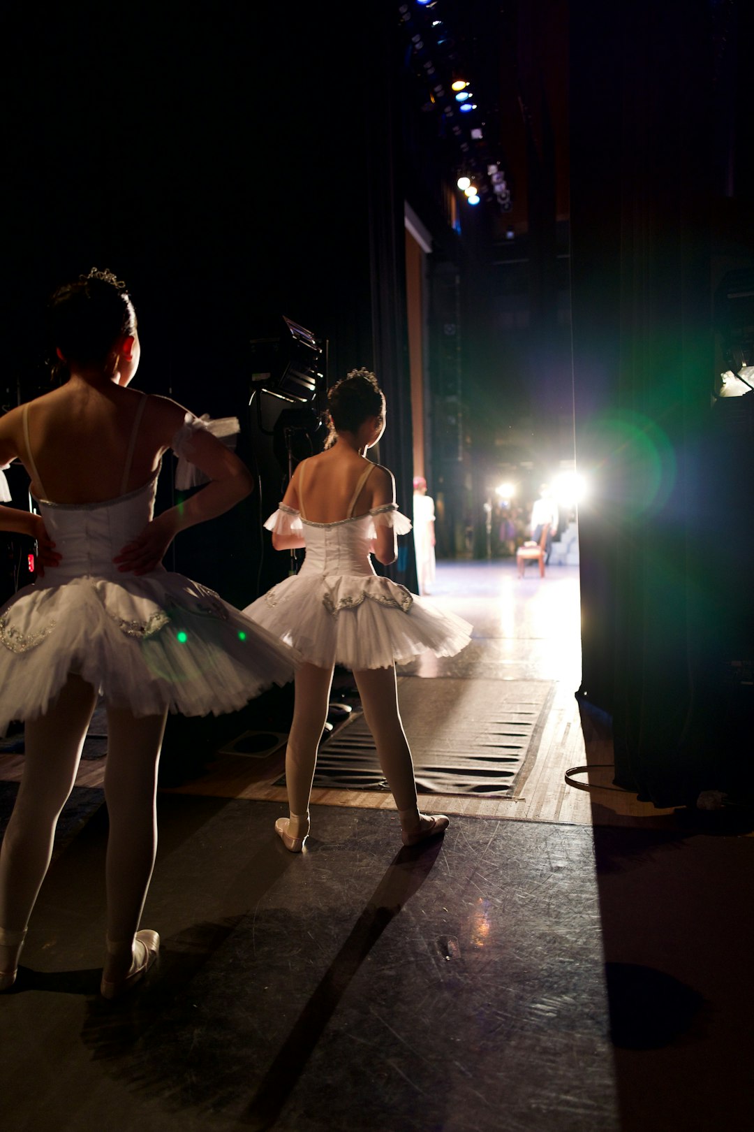 2 women in white dress dancing