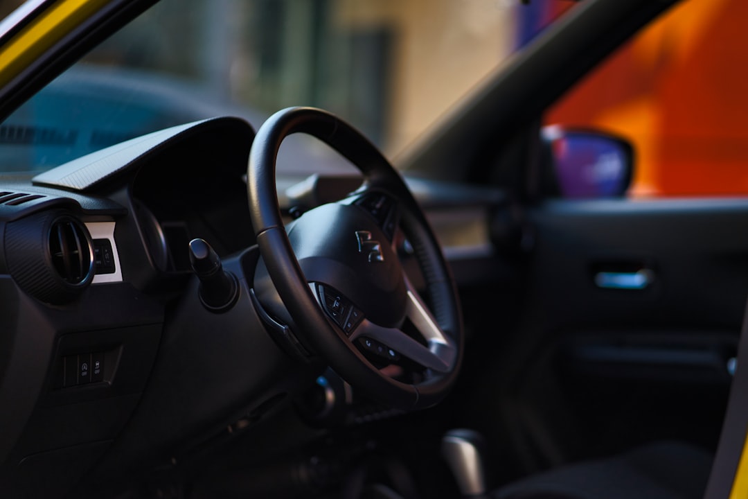 black steering wheel in close up photography