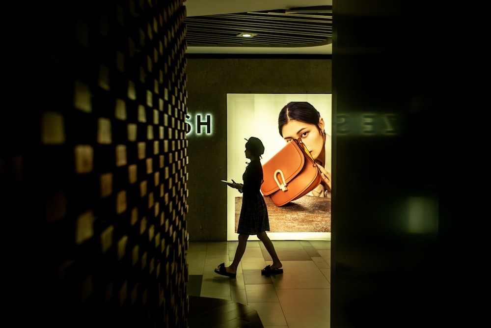 woman in black dress standing on hallway