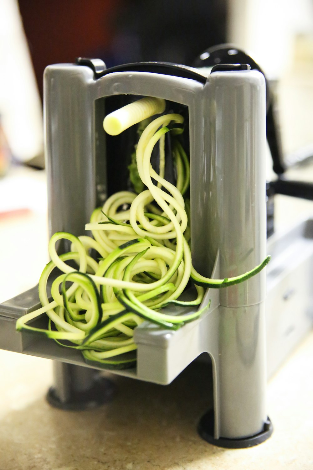 green rubber band on black device, zucchini