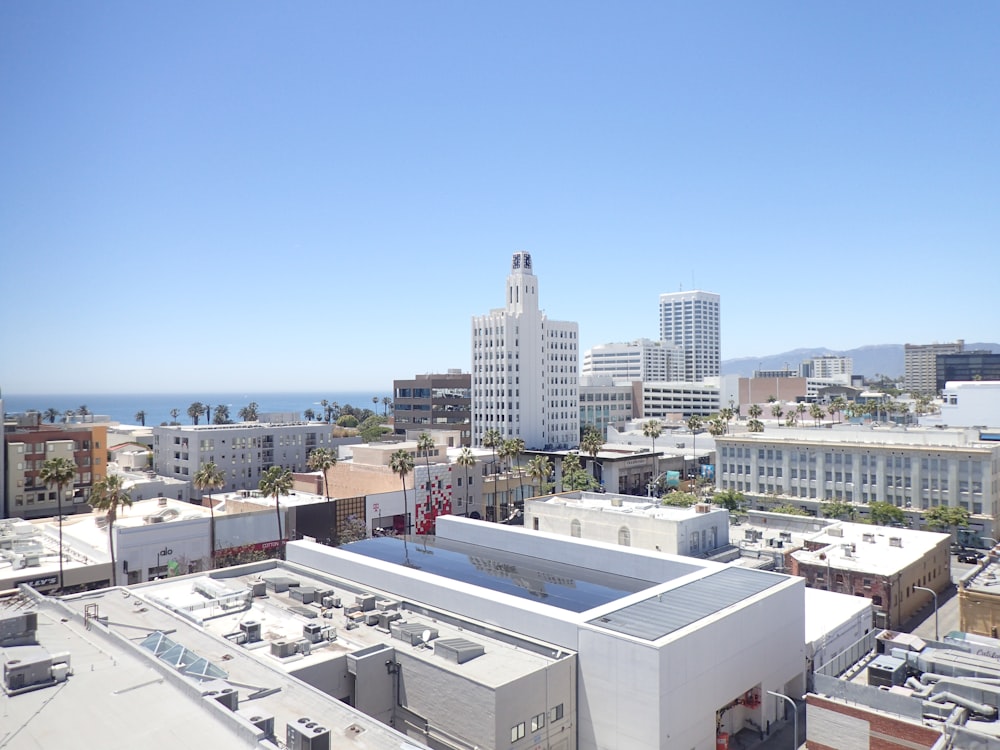 white concrete buildings under blue sky during daytime