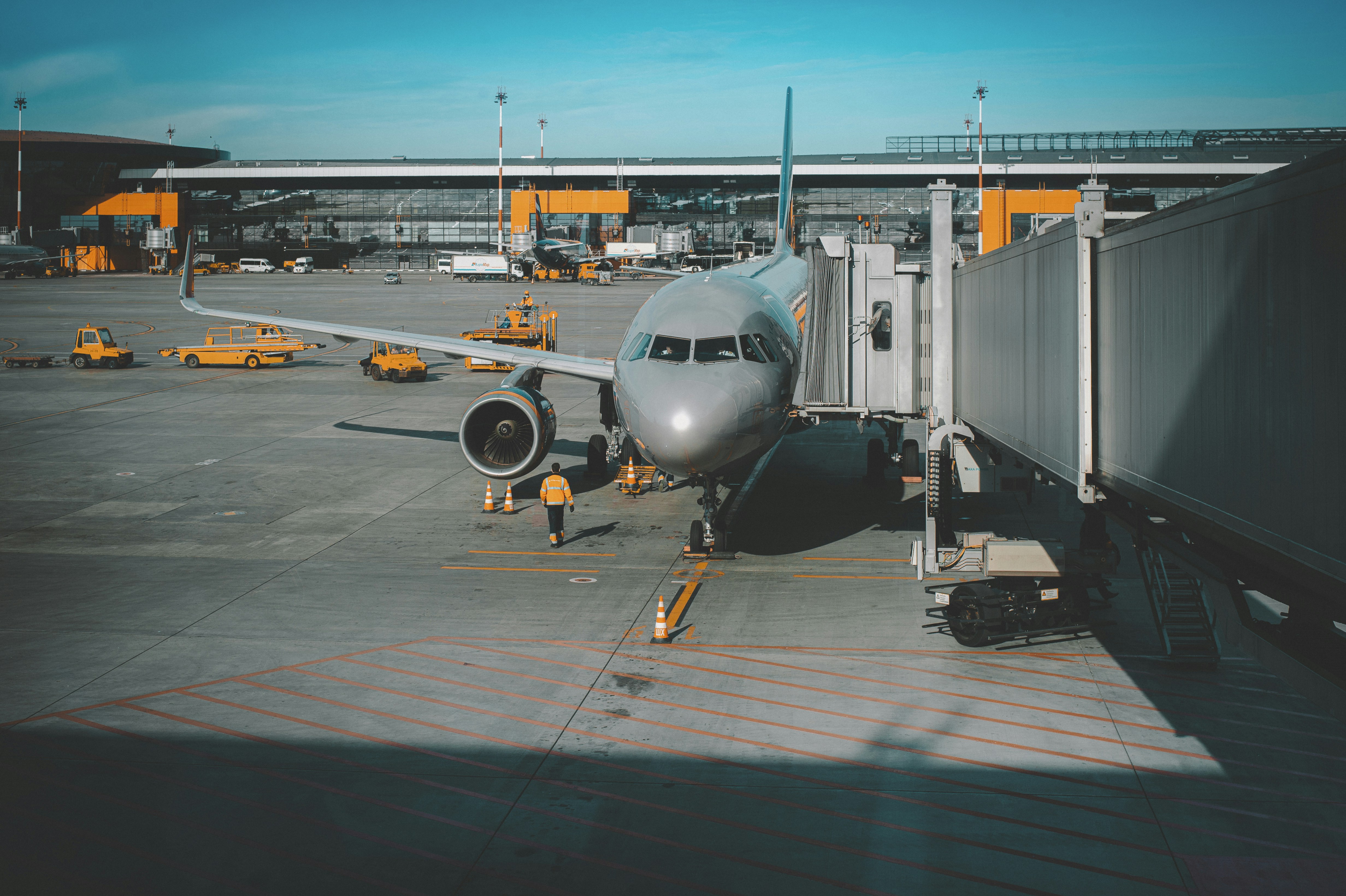 A passenger plane on the airport runway.