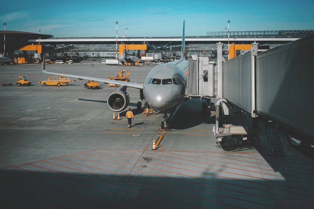 white airplane on airport during daytime