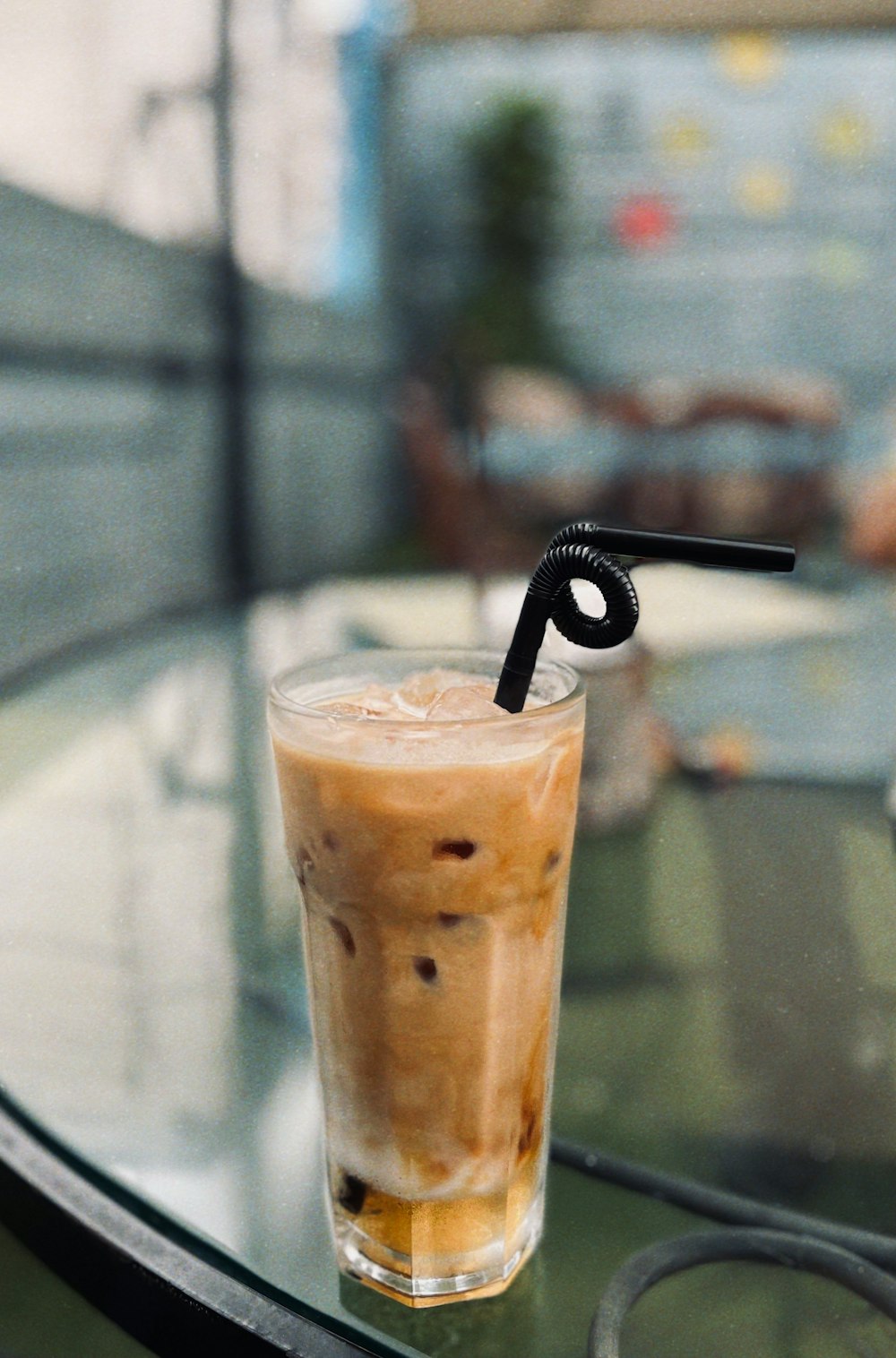 clear drinking glass with brown liquid