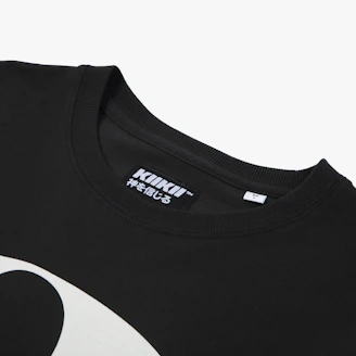 A close-up of a black t-shirt with red poetic script printed elegantly across the chest.