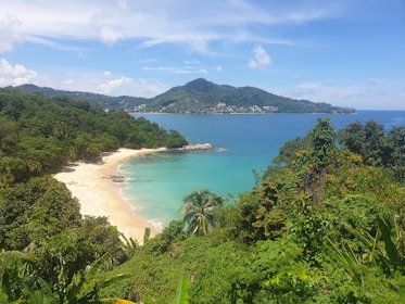 A picturesque beach with golden sands and clear blue waters.