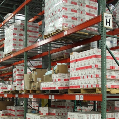 white and red cardboard boxes on shelf