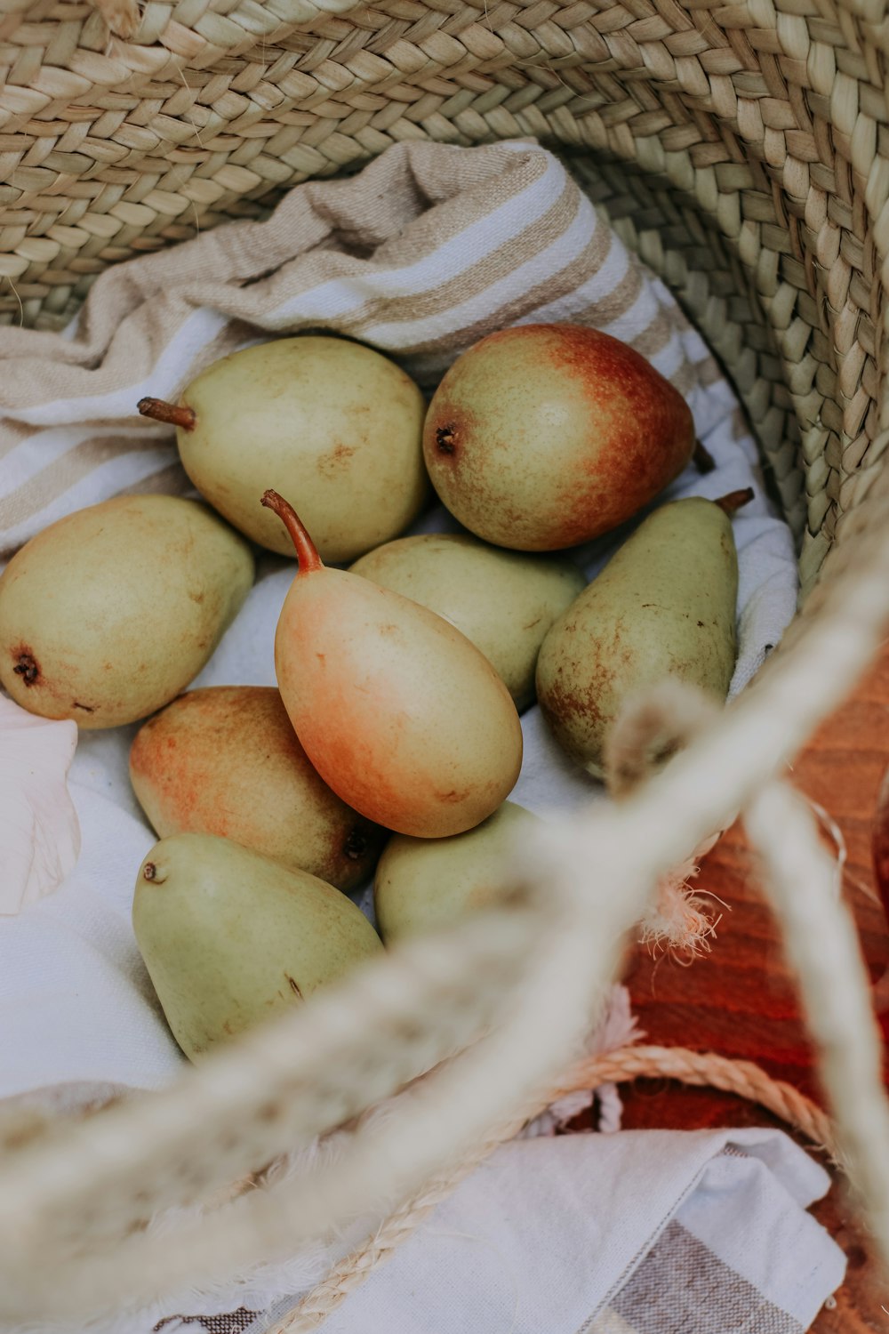 green and red apples on white ceramic bowl