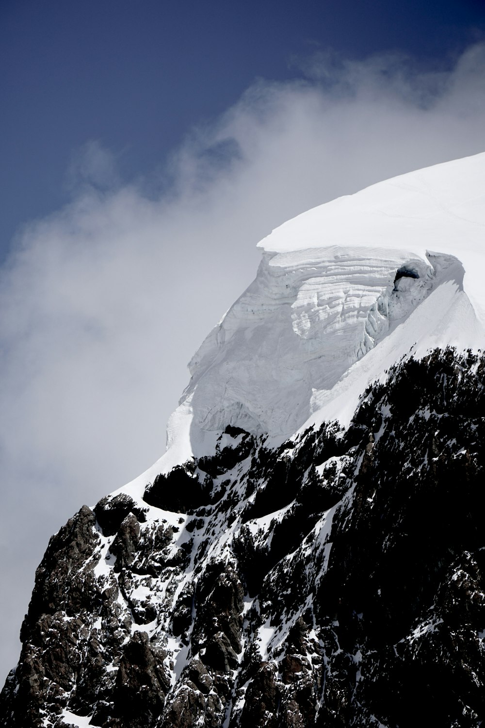 snow covered mountain under blue sky during daytime