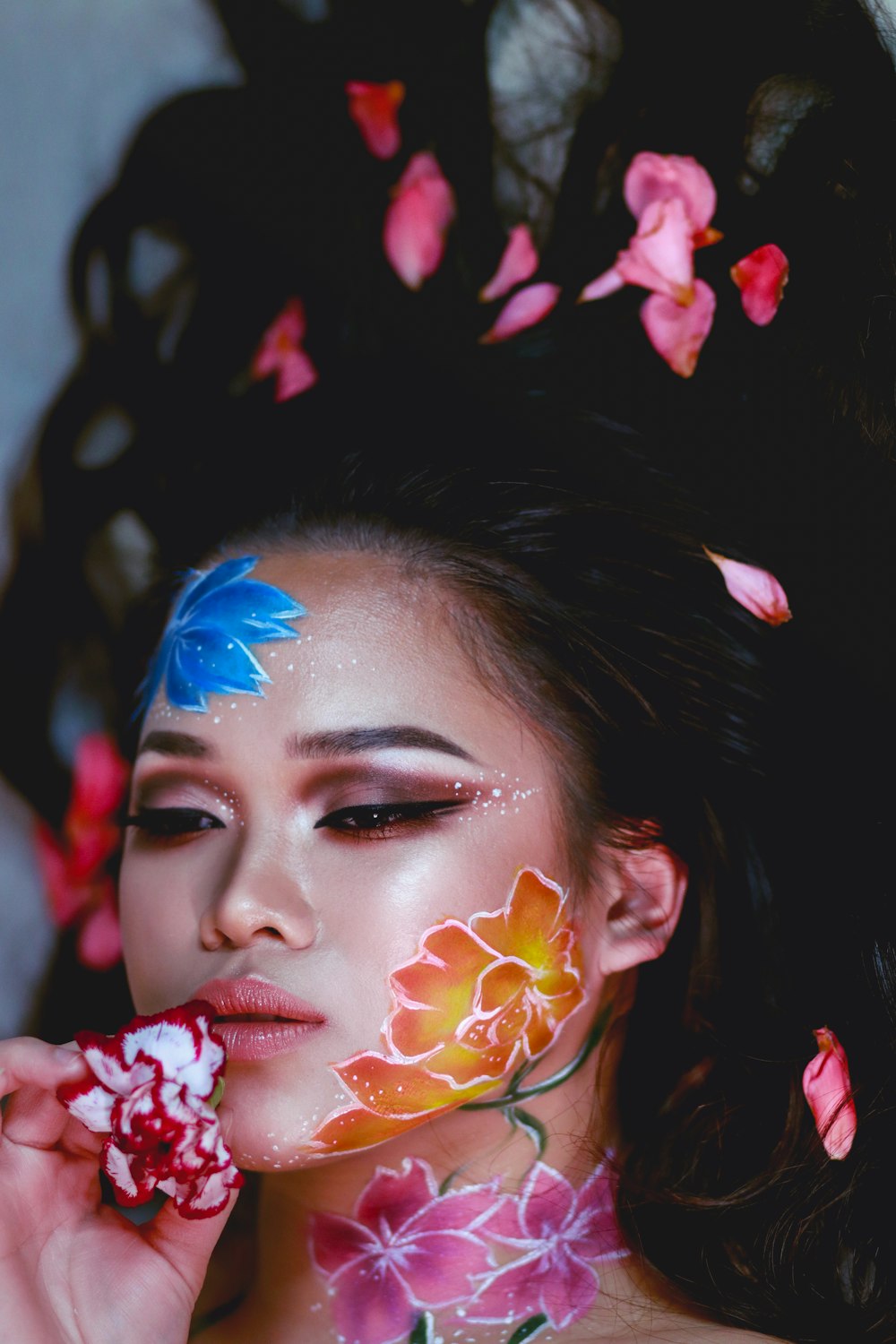 woman with blue and white face paint