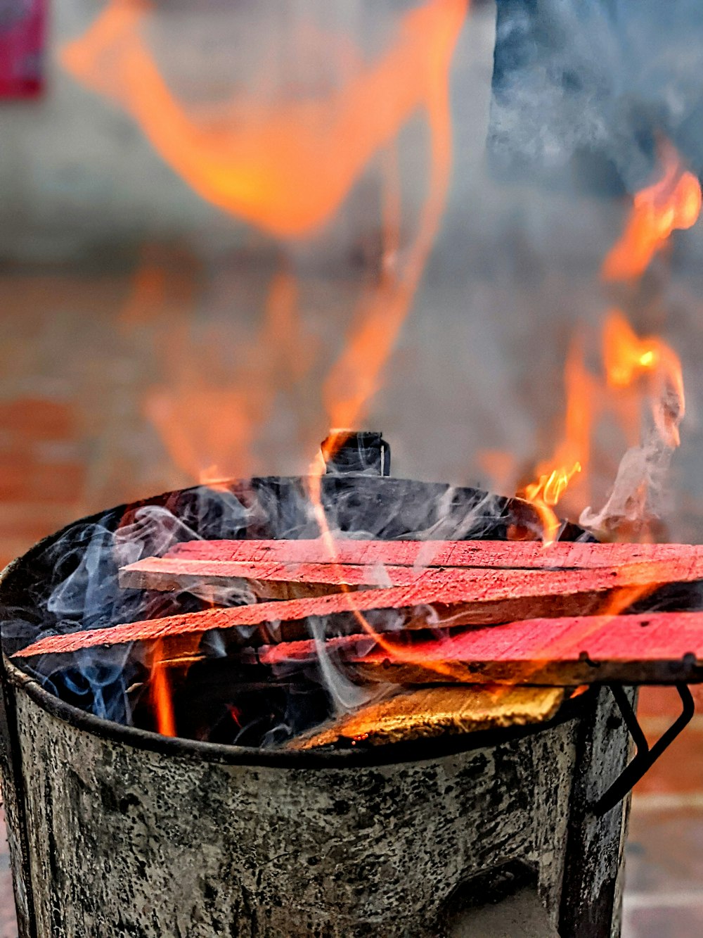 fire in black round container