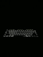 A compact wireless keyboard with illuminated keys glowing gently in low light.