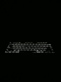 A high-end mechanical keyboard with subtle lighting.