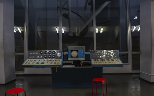 An imposing brass control panel with toggles and gauges humming in dim light.