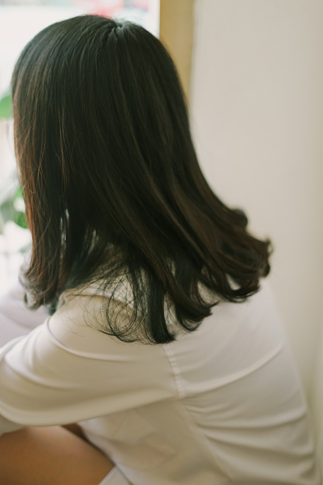 woman in white long sleeve shirt