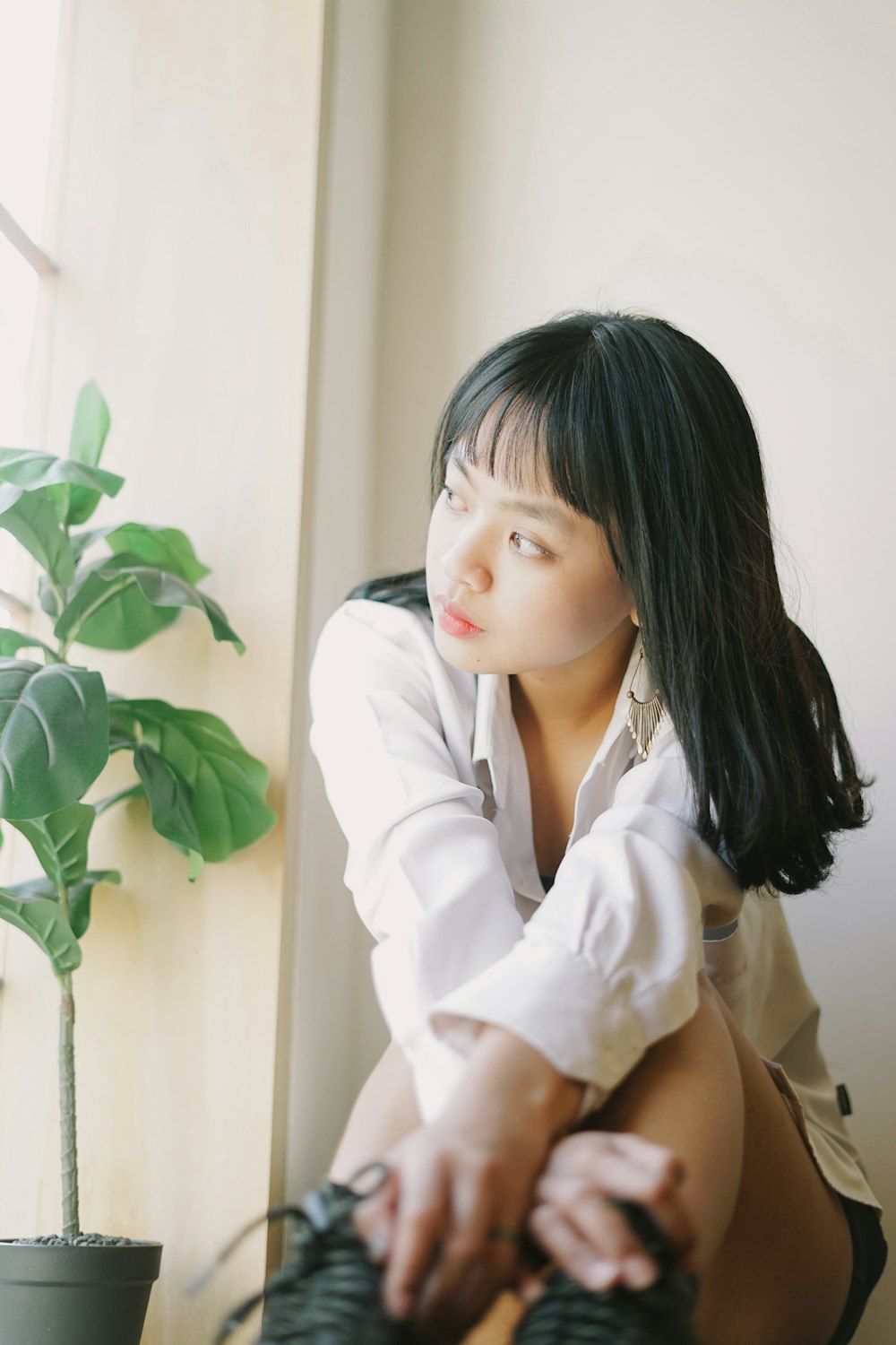 woman in white long sleeve shirt