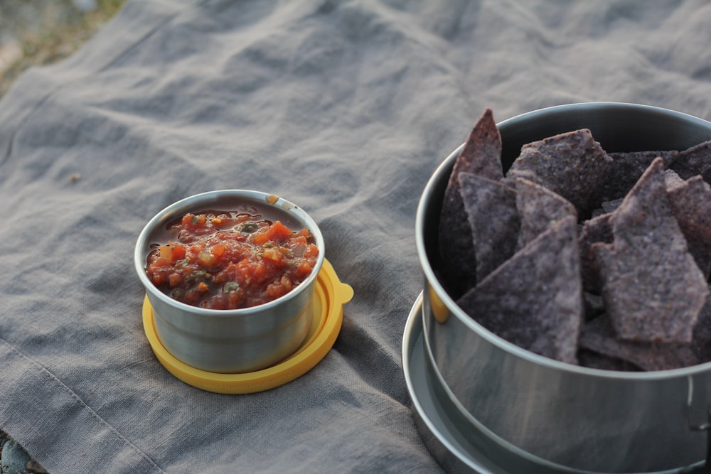 stainless steel bowl with red sauce