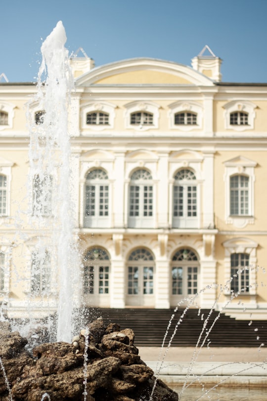 water fountain in front of white building in Rundāle Palace Latvia