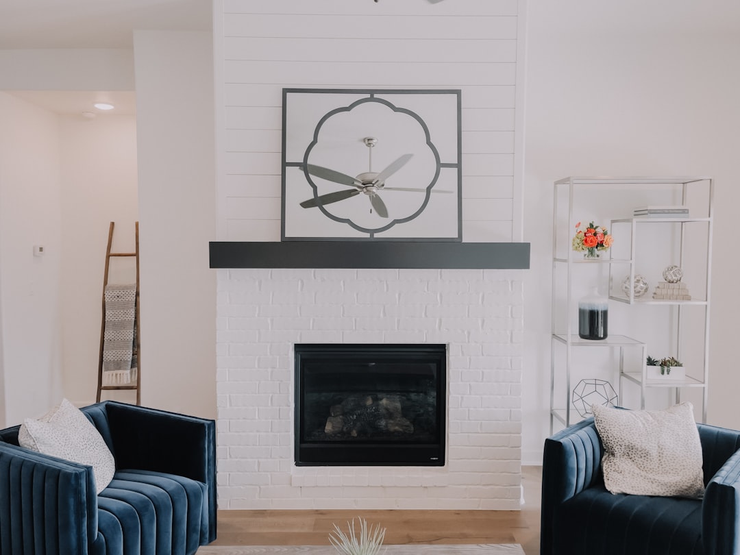 black fireplace in white room,