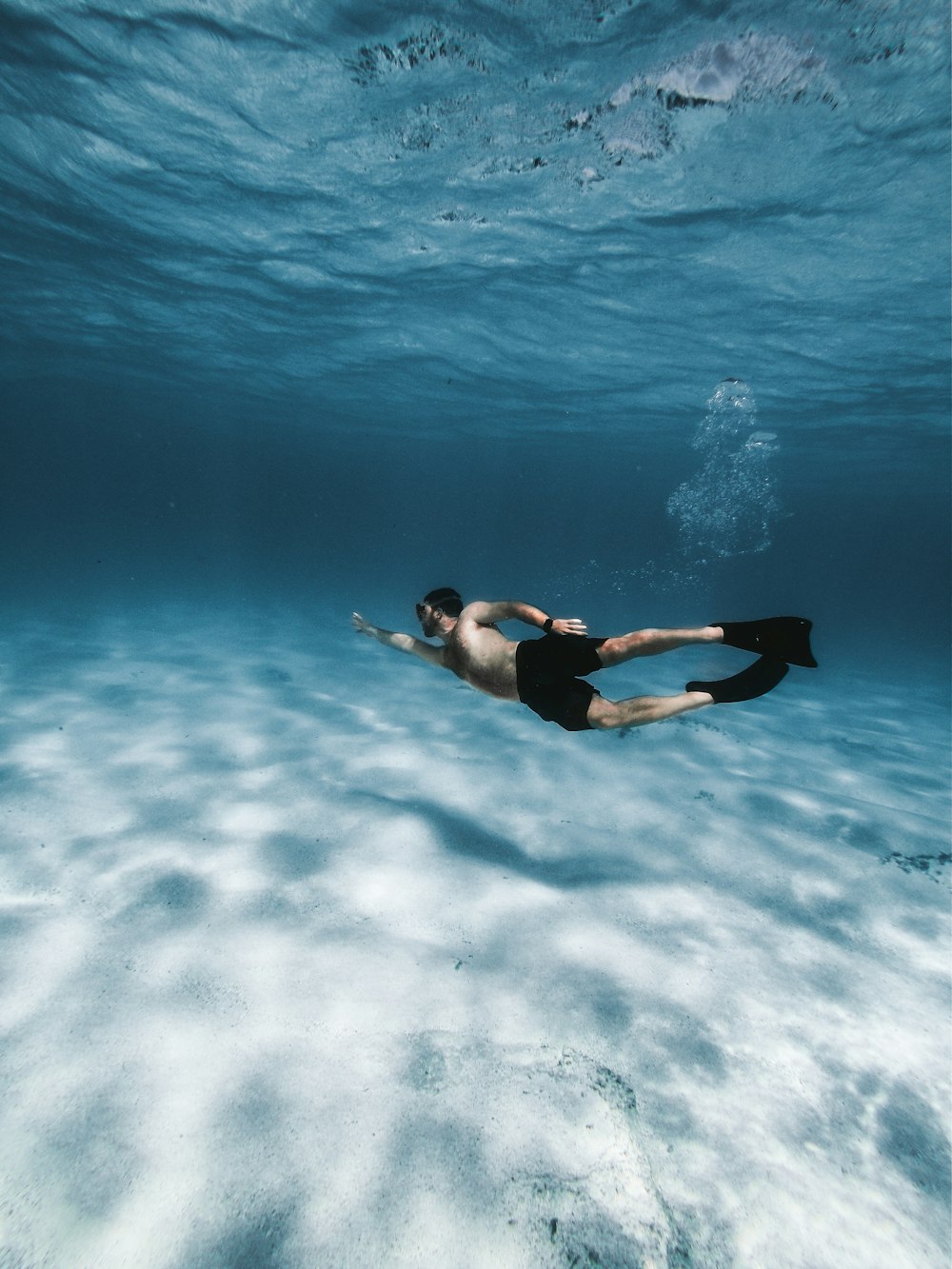 woman in black bikini in water