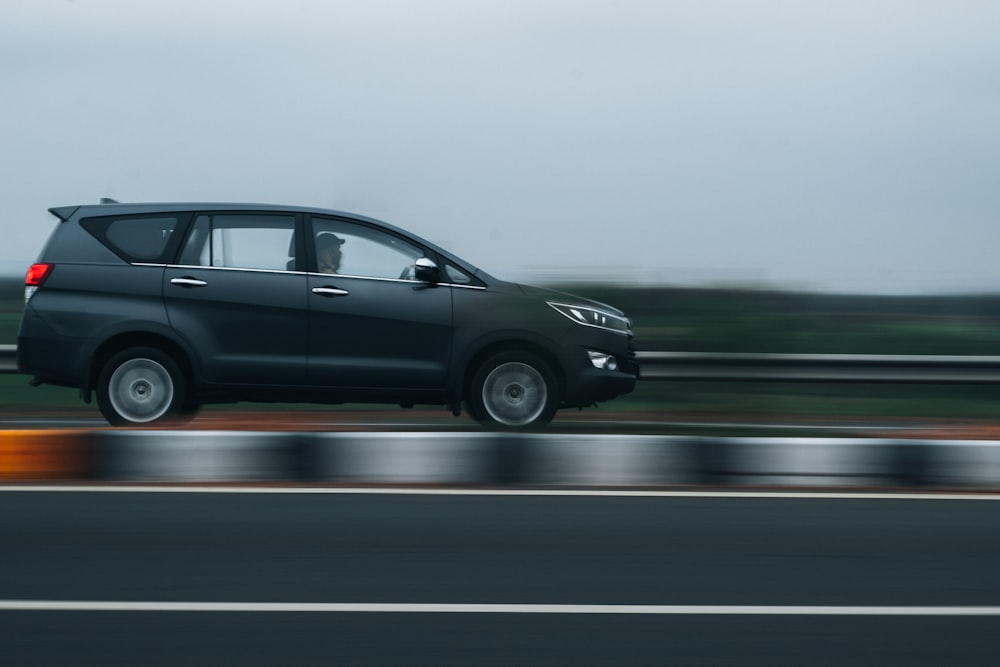 black mercedes benz c class on gray asphalt road