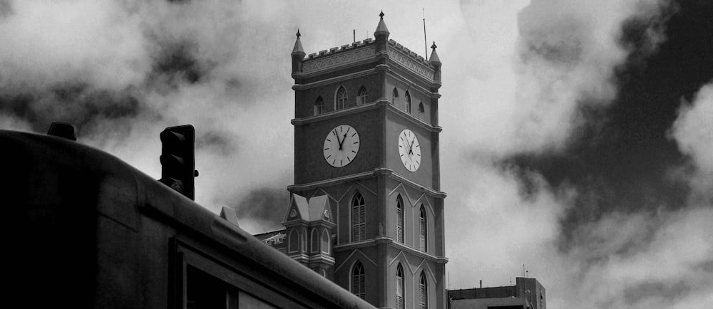 grayscale photo of clock tower