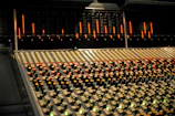 Mixing console with colorful lights in a music production studio