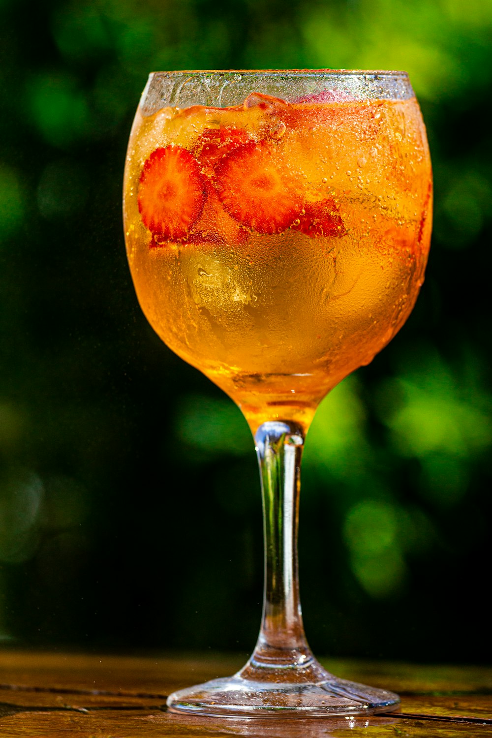 clear wine glass with orange liquid