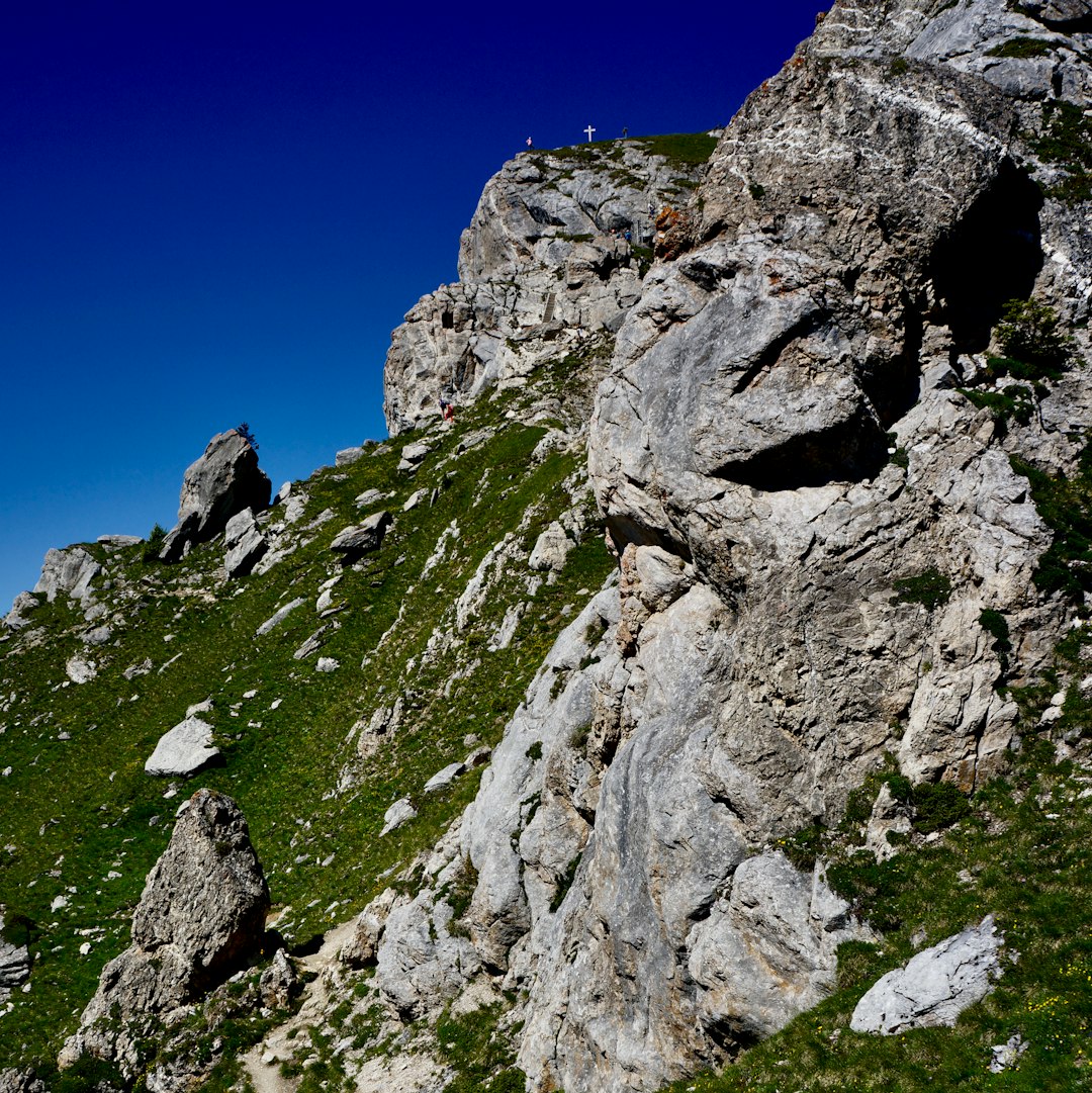 gray rocky mountain under blue sky during daytime