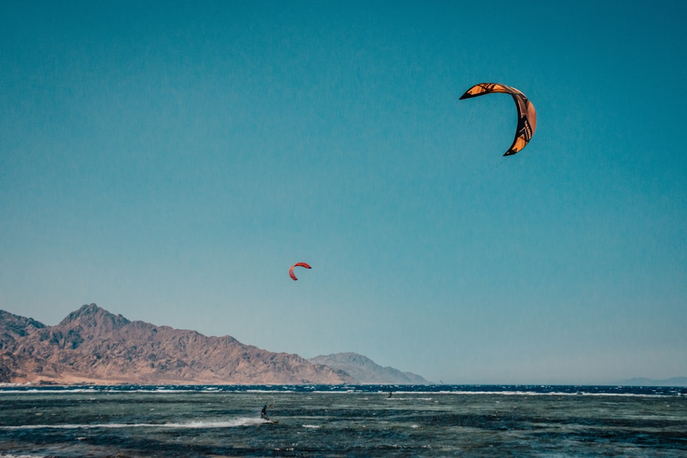 person surfing on sea during daytime