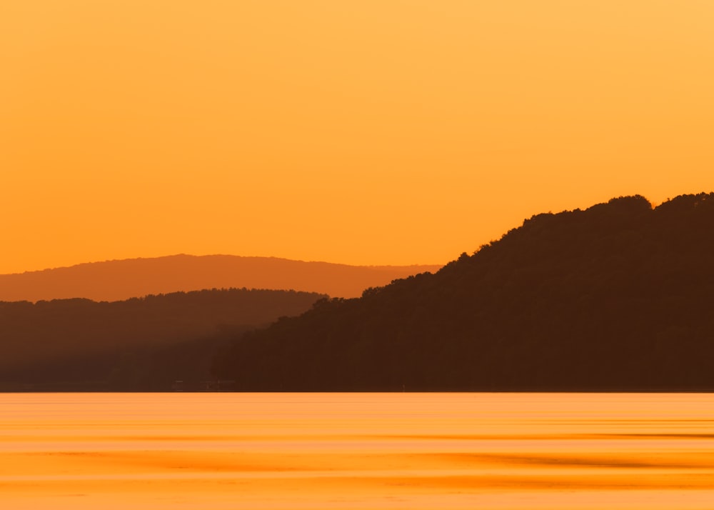 silhouette of mountain during sunset