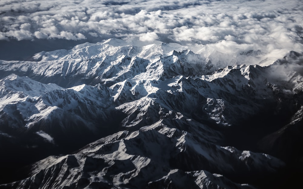 black and white mountains under white clouds during daytime