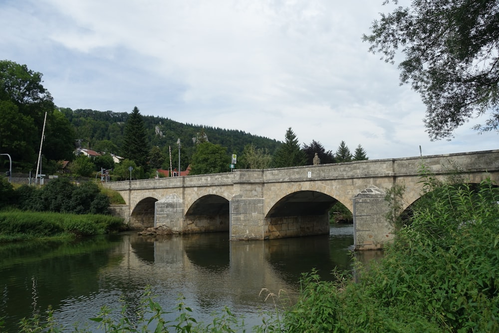 gray concrete bridge over river