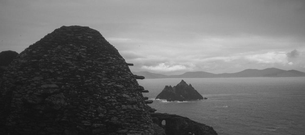 grayscale photo of rocky beach