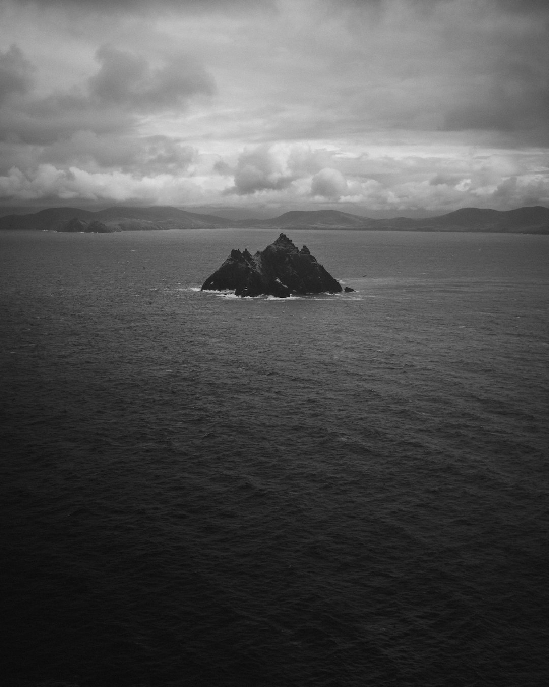 grayscale photo of a boat on the sea