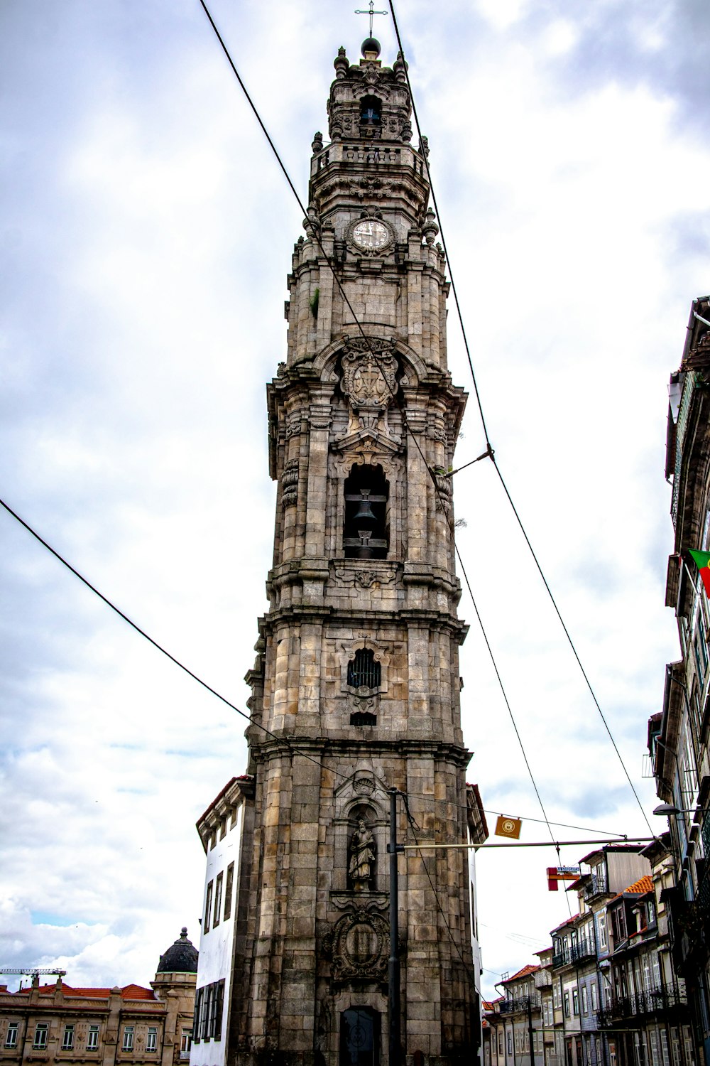 brown concrete tower under white clouds during daytime