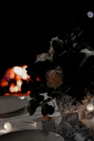 An elegant dinner setting with candles and soft lighting.