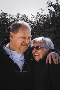 man in black jacket beside woman in black jacket