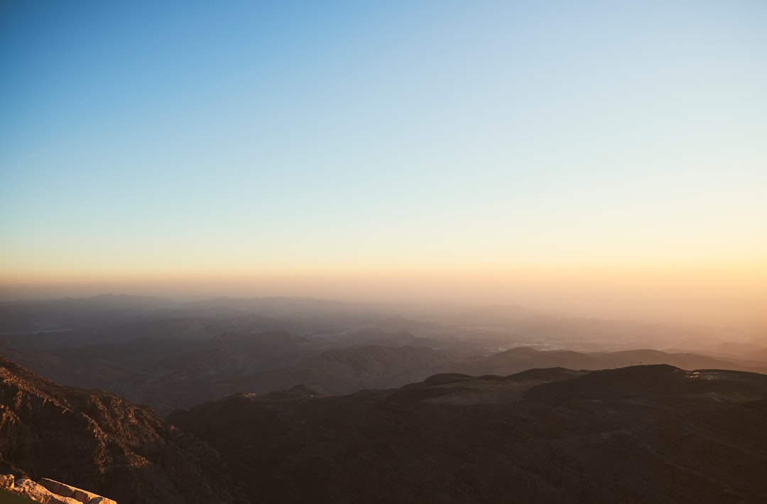 brown mountains under blue sky during daytime